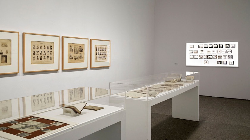 Installation view of the exhibition 'Documentary Genealogies: Photography 1848-1917' at the Museo Nacional Centro de Arte Reina Sofía, Madrid showing at left rear, pages from Carl Dammann's '[Races of Mankind]: Ethnological Photographic Gallery of the Various Races of Men' 1876