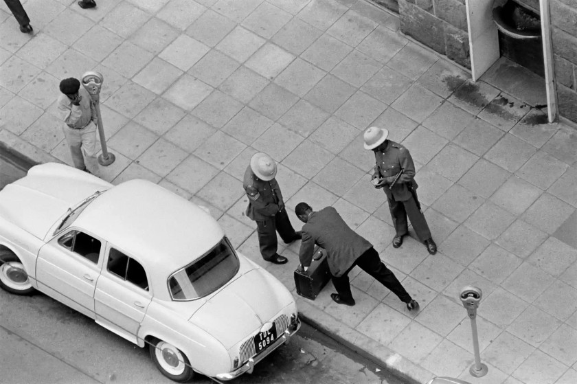 Ernest Cole (South African, 1940-1990) 'SOUTH AFRICA. 1960s. A pass raid outside Johannesburg station. Every African had to show his pass before being allowed to go about his business. Sometimes these police checks broadened into body and belongings searches' 1960-1966