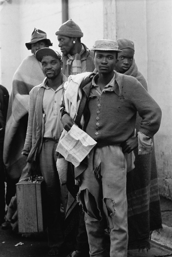 Ernest Cole (South African, 1940-1990) 'Pensive tribesmen, newly recruited to mine labour, awaiting processing and assignment' 1960-1966