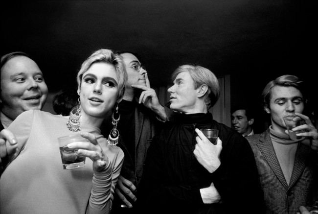 Steve Schapiro (American, 1934-2022) 'Edie Sedgwick, Andy Warhol, and others at a party' 1965