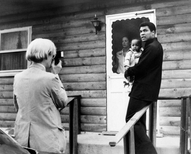 Andy Warhol (American, 1928-1987) 'Muhammad Ali, his infant daughter, Hanna, and wife, Veronica at Ali's training camp in Deer Lake, PA' August 18, 1977