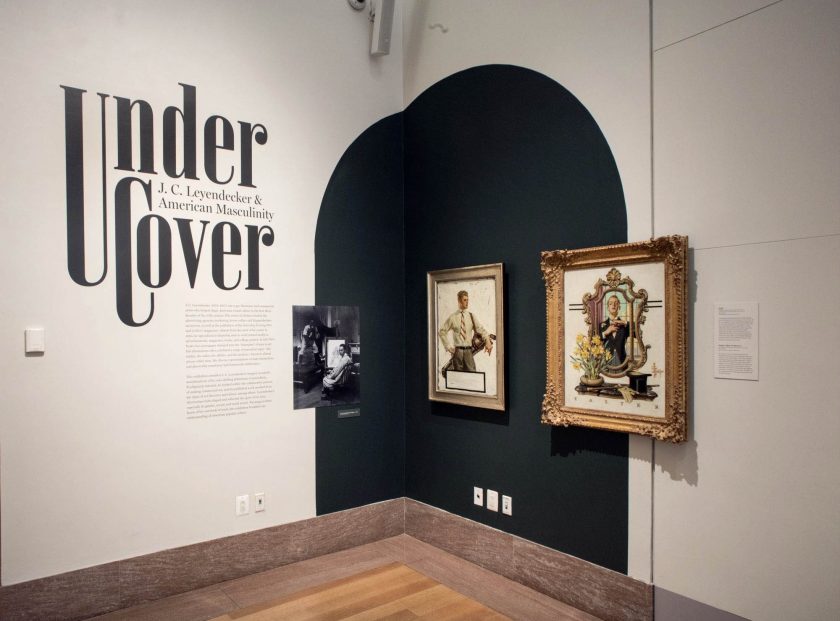 Installation view of the exhibition 'Under Cover: J.C. Leyendecker and American Masculinity' at the New-York Historical Society showing at right, Leyendecker's 'Easter – Man in the Mirror Painting' for cover of 'Saturday Evening Post', April 11, 1936 (below)
