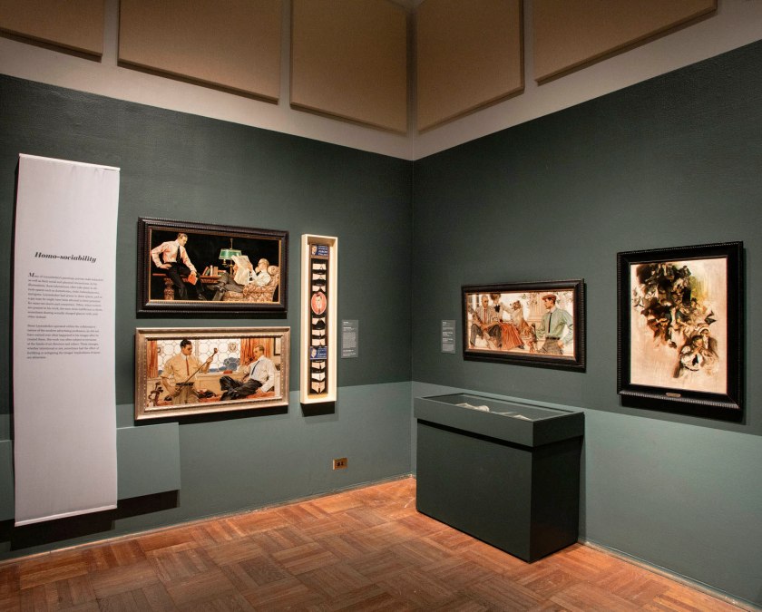 Installation view of the exhibition 'Under Cover: J.C. Leyendecker and American Masculinity' at the New-York Historical Society showing at left top, 'Men Reading' (1914) and at left bottom, 'Men with Golf Clubs' (c. 1909)