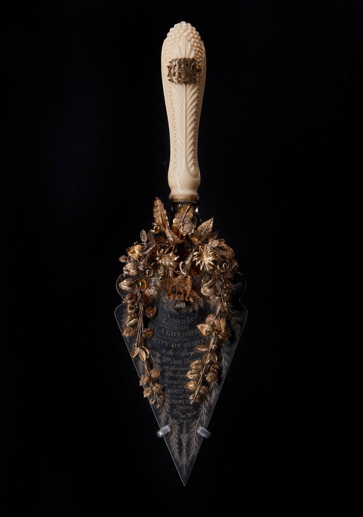 Installation view of the exhibition '1,001 Remarkable Objects' at Powerhouse Ultimo, Sydney showing William Kerr's Presentation trowel (c. 1883)