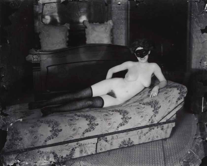 E. J. Bellocq (American, 1873-1949) 'No title (Woman reclining with mask)' c. 1912, printed c. 1981