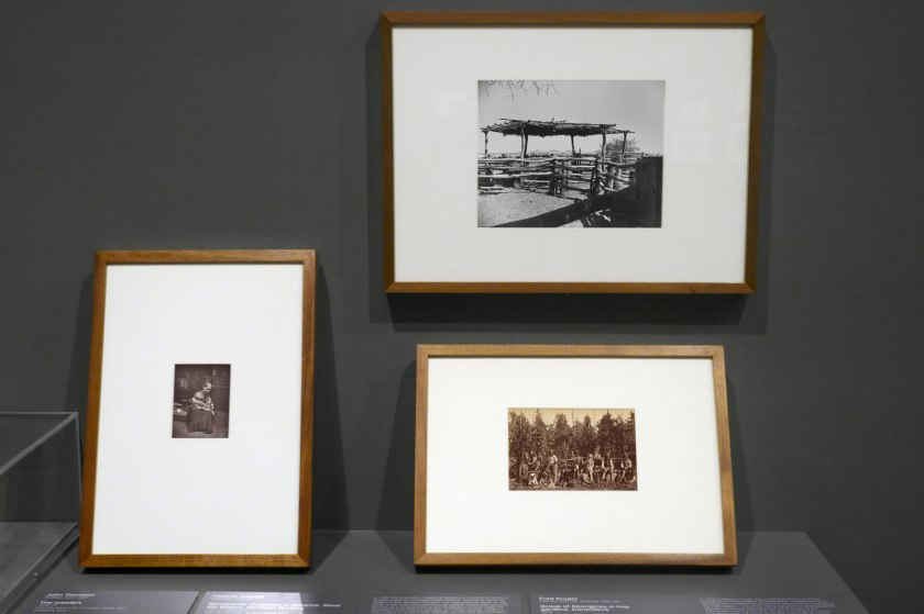 Installation view of the exhibition 'Photography: Real & Imagined' at The Ian Potter Centre: NGV Australia, Melbourne showing  at left, John Thomson's 'The crawlers' (1876-1877, below); at top right, Heather George's 'Stockyards, stockmen in distance. Wave Hill Station, Northern Territory' (1952); and at bottom right, Fred Kruger's 'Group of Aborigines in hop gardens, Coranderrk' (1876, below)