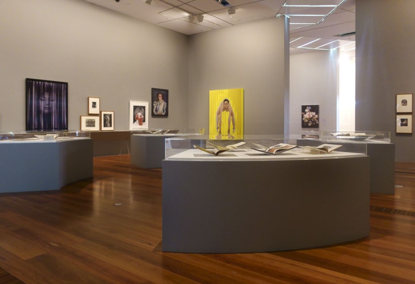 Installation view of the exhibition 'Photography: Real & Imagined' at The Ian Potter Centre: NGV Australia, Melbourne showing at back left, Robyn Stacey's 'Nothing to see here' (2019) and at back centre, Polly Borland's 'Untitled' (2018)