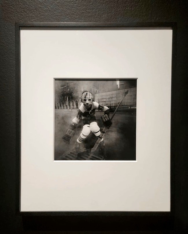Installation view of the exhibition Arthur Tress: Rambles, Dreams, and Shadows at the J. Paul Getty Museum, Los Angeles showing 'Hockey Player, New York' (1972)