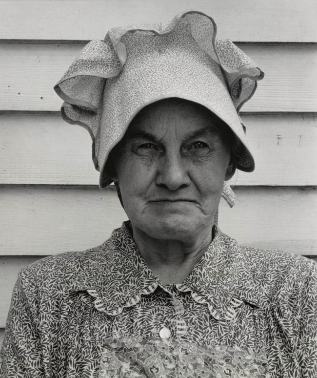 Dorothea Lange (American, 1895-1965) 'Member of the congregation of Wheeley's church who is called "Queen." She is wearing the old-fashioned type of sunbonnet. Her dress and apron were made at home. Near Gordonton, North Carolina' from 'The American Country Woman' July 1939, printed no later than 1965