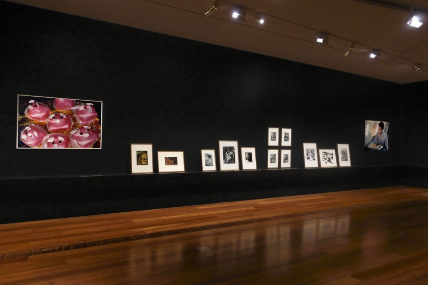 Installation view of the exhibition 'Photography: Real & Imagined' at The Ian Potter Centre: NGV Australia, Melbourne showing at left, Martin Parr's 'Pink pig cakes' from 'Common Sense' (1995-1999) showing at left, Martin Parr's 'Pink pig cakes' from 'Common Sense' (1995-1999); at fourth left, ringl+pit's 'Komol' (1931); at fifth left, Ilse Bing's 'Salut de Schiaparelli' (1934); and at sixth left, Dora Maar's 'Untitled (Study of Beauty)' (1936)