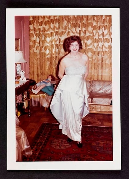 Unknown photographer (American) 'Vicky in the living room in a white evening gown, New York City apartment' January 1962